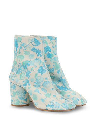 Maison Margiela Tabi Ankle Boot 80mm, pair at three-quarter angle revealing the iconic Tabi split toe and all-over watercolour floral print in blue and mint on cream suede