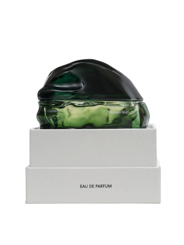 Manuel Mathieu perfume bottle with green and black design on a white background