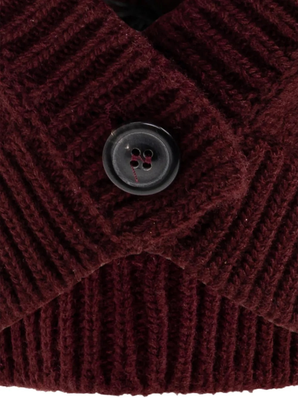 Close-up packshot of the button detail on the Maison Margiela Beanie in Burgundy, emphasizing the functional balaclava closure and Four Stitch branding.
