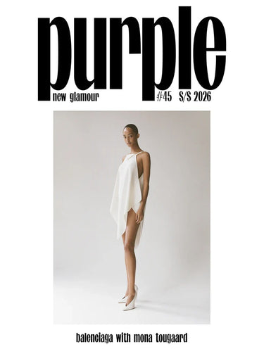 Magazine cover with a model in a white dress against a gray background, featuring the text 'Purple New Glamour' and 'Balenciaga with Mona Lougaard'.