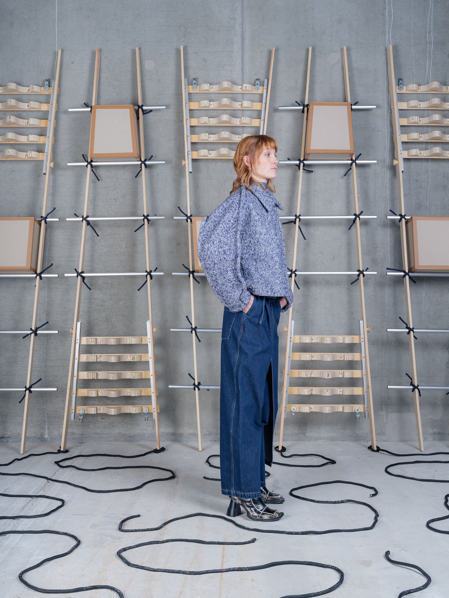 Model wearing Relaxed Dartbi Jacket in Blue Pebbles by Henrik Vibskov side view