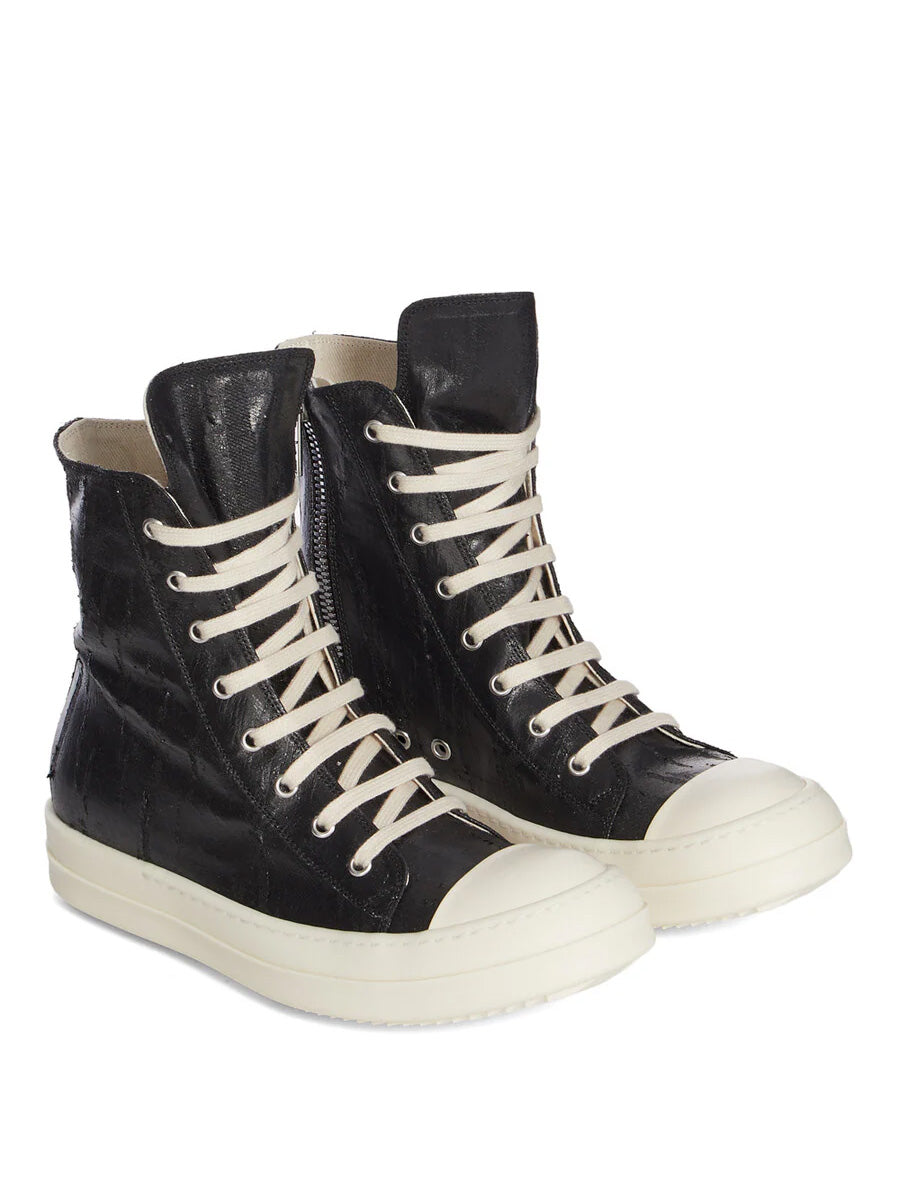 Angled view of Rick Owens DRKSHDW Tower Sneaks in Black Megacrust Denim with cracked black upper, cream laces, milk white toe caps and shark tooth sole