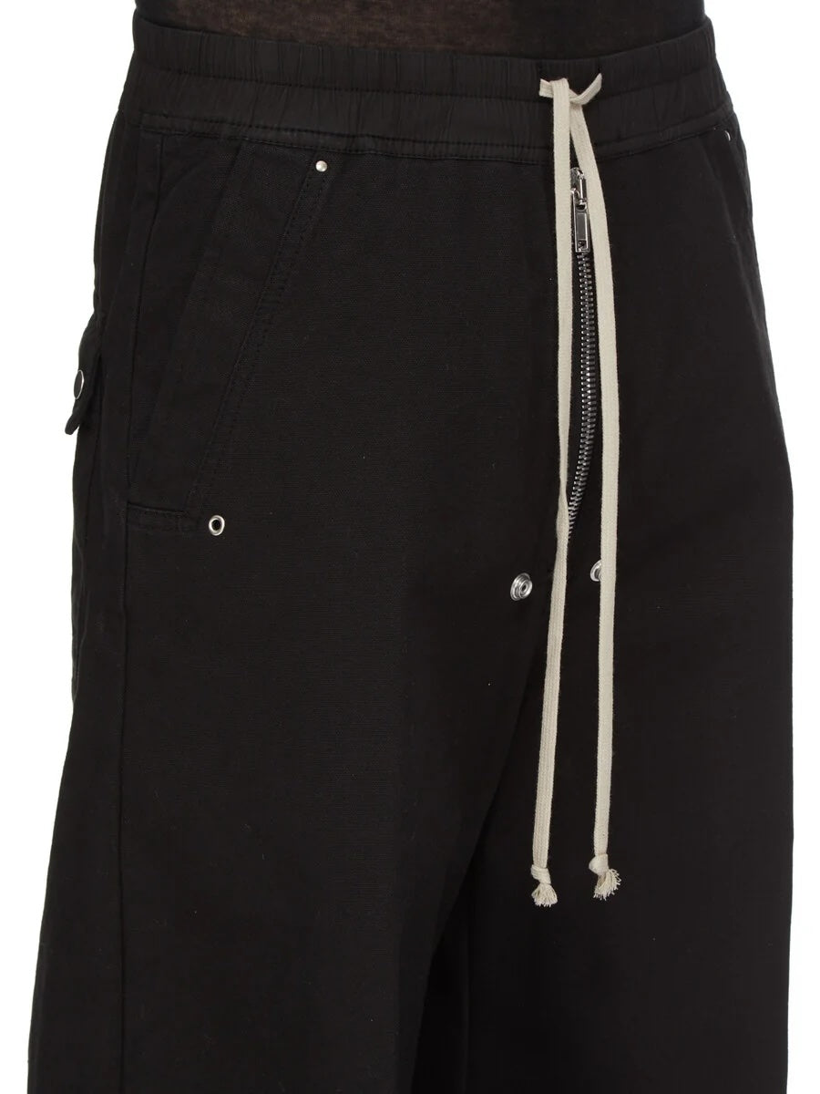 Detail view of Rick Owens DRKSHDW Geth Belas in black showing the elasticated waistband, cream drawstring and exposed Bela centre zipper.