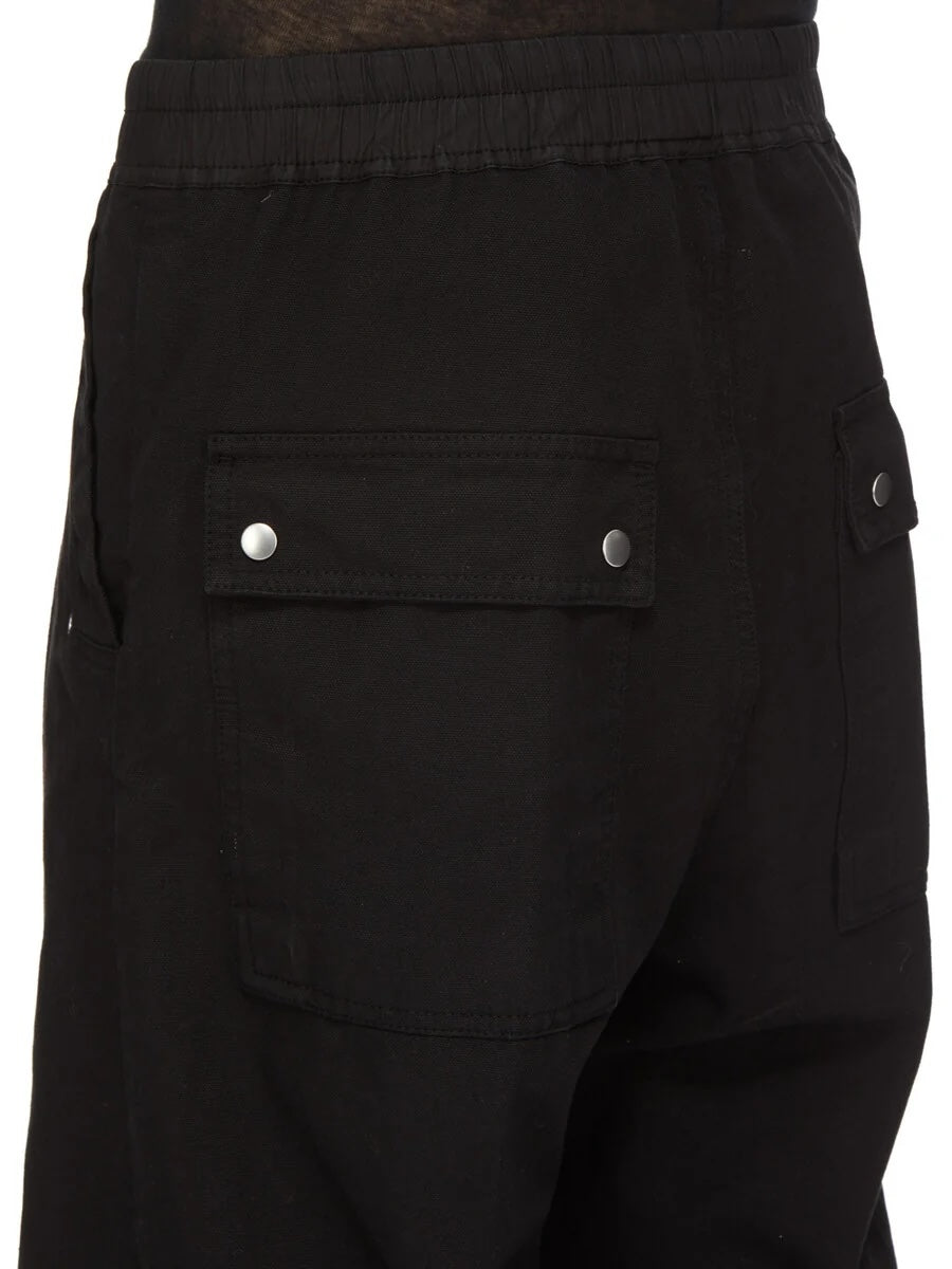 Detail view of Rick Owens DRKSHDW Geth Belas in black showing the back flap pocket with visible snap closures.