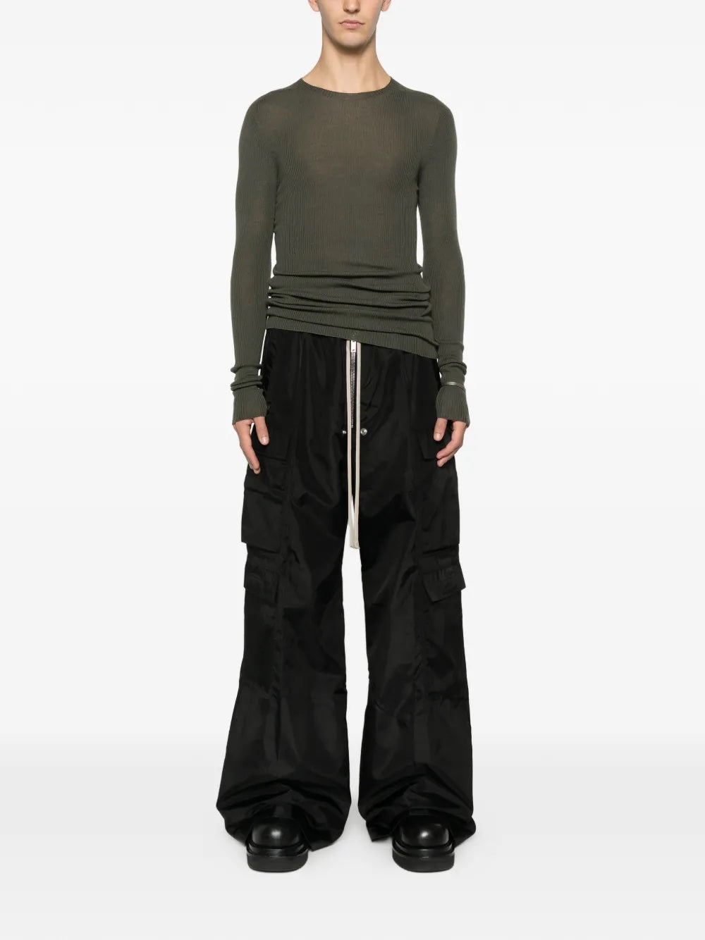 Someone wearing the black cargo pants with long drawstrings from Rick Owens DRKSHDW on a white background