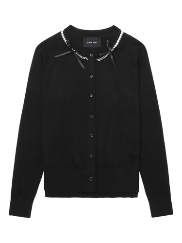 Black cardigan with pearl embellishments on a white background