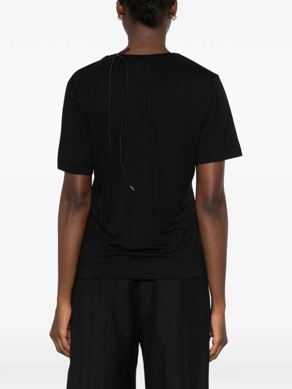Back view of Simone Rocha Cord Neck Easy T-Shirt in black with short sleeves, rear tie fastening and straight hem