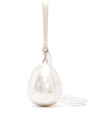 Product image of the Simone Rocha Pearl Crossbody Micro Egg Bag on a white background, featuring an egg-shaped silhouette with a glossy faux pearl finish.