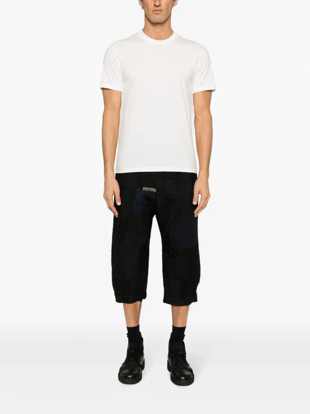 Model wearing the Maison Margiela Snow T-shirt featuring a crew neck, short sleeves, and a classic fit, shown from the front.