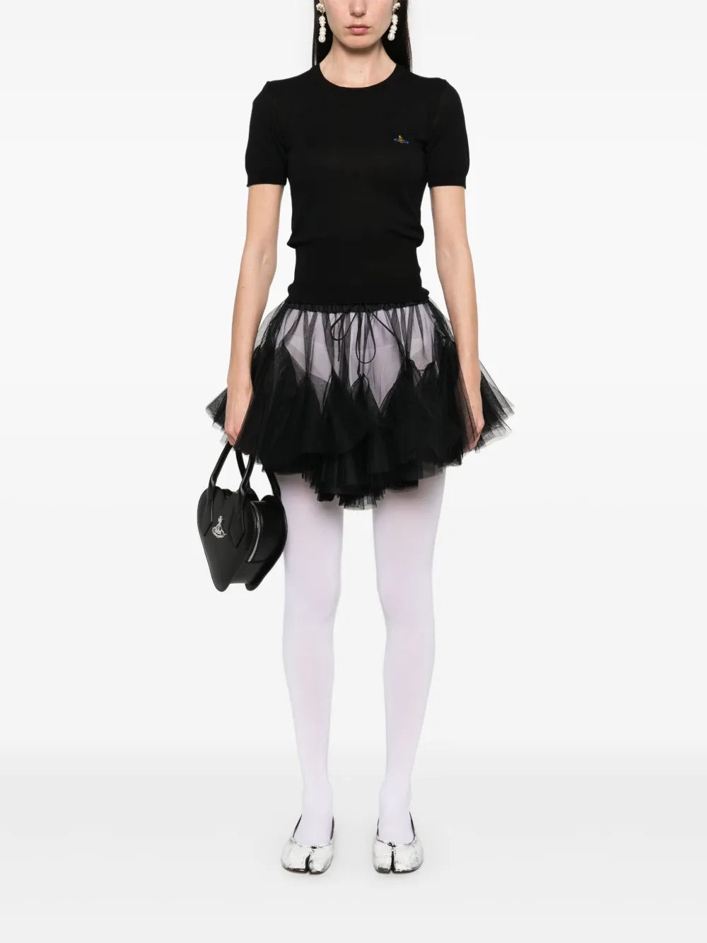 Model wearing Bea Top in Black by Vivienne Westwood, full-length front view of slim-fit black crew neck top with short sleeves and multicolour Orb embroidery, Spring/Summer 2026