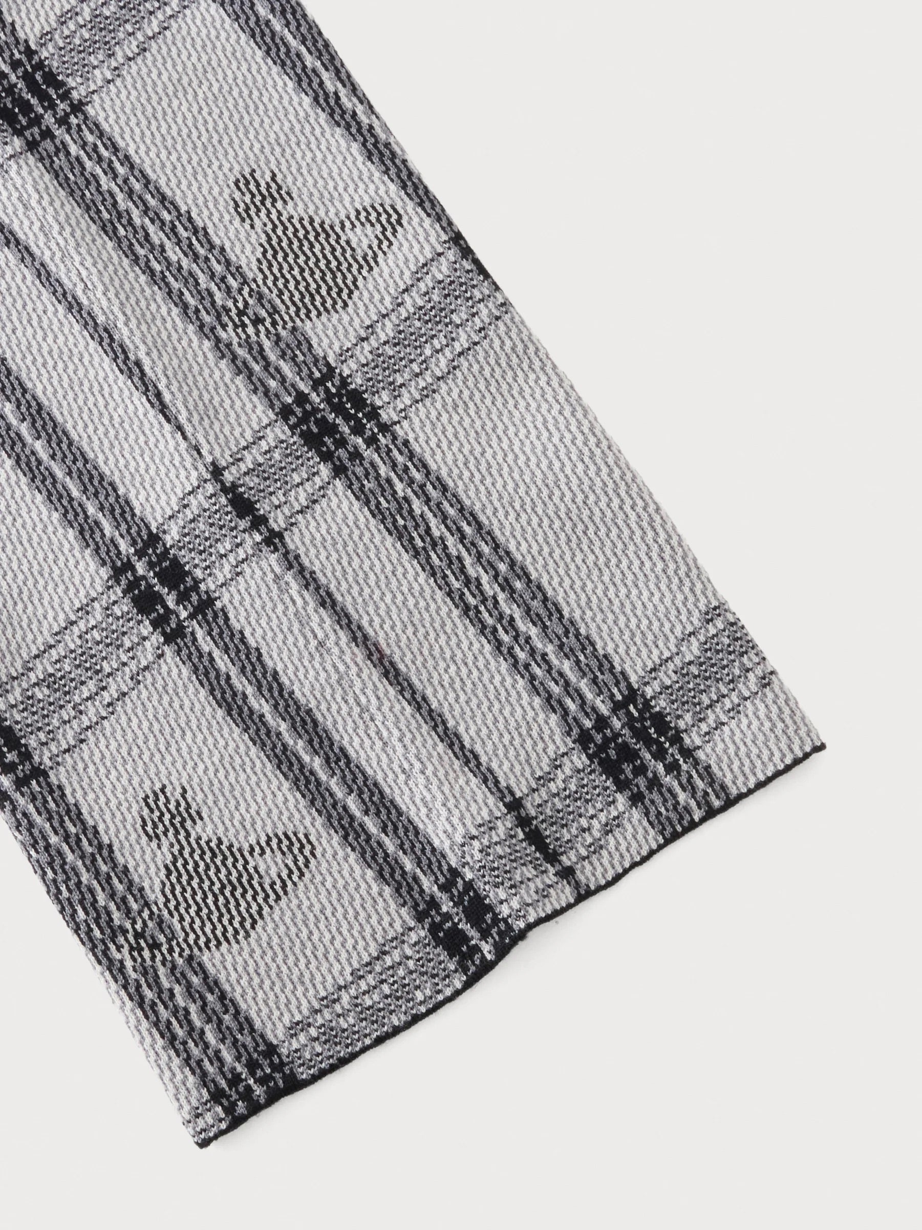 Vivienne Westwood Bi Tartan Hood in Black, close-up of black and white tartan knit texture and orb motif
