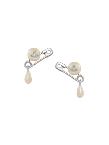Pair of pearl earrings from Vivienne Westwood with safety pin design on a white background