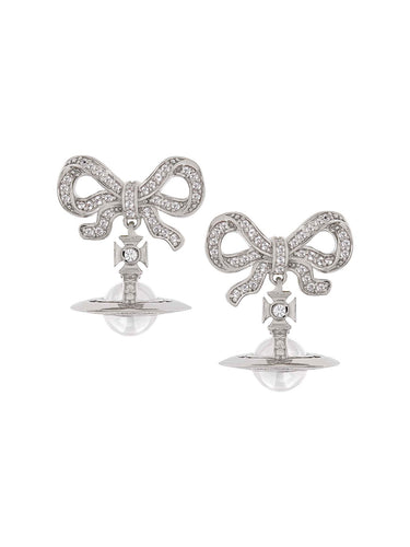 Pair of silver bow-shaped earrings with clear gemstones on a white background
