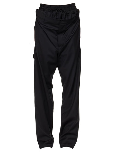 Black, layered-design trousers from Vivienne Westwood on a white background