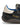 Close-up of Wales Bonner co-branding and gold-tone eyelets on the Karintha OG in Core Black Wonder White Lush Blue leather sneaker – Wales Bonner x Adidas SS26