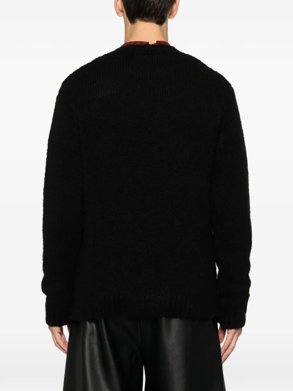 Back view of the black knitted sweater with skull illustration from Walter Van Beirendonck on a white background.