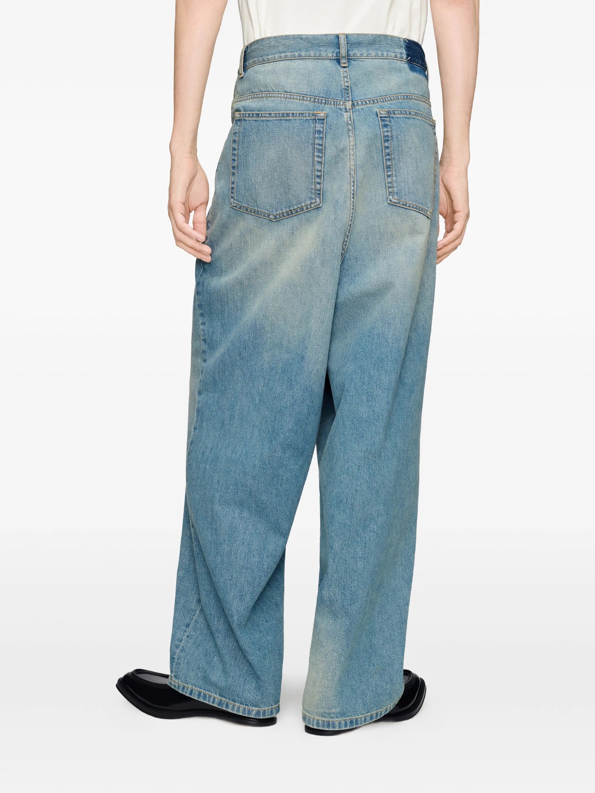 Back view of Maison Margiela Wrap Denim Trousers in Old Blue