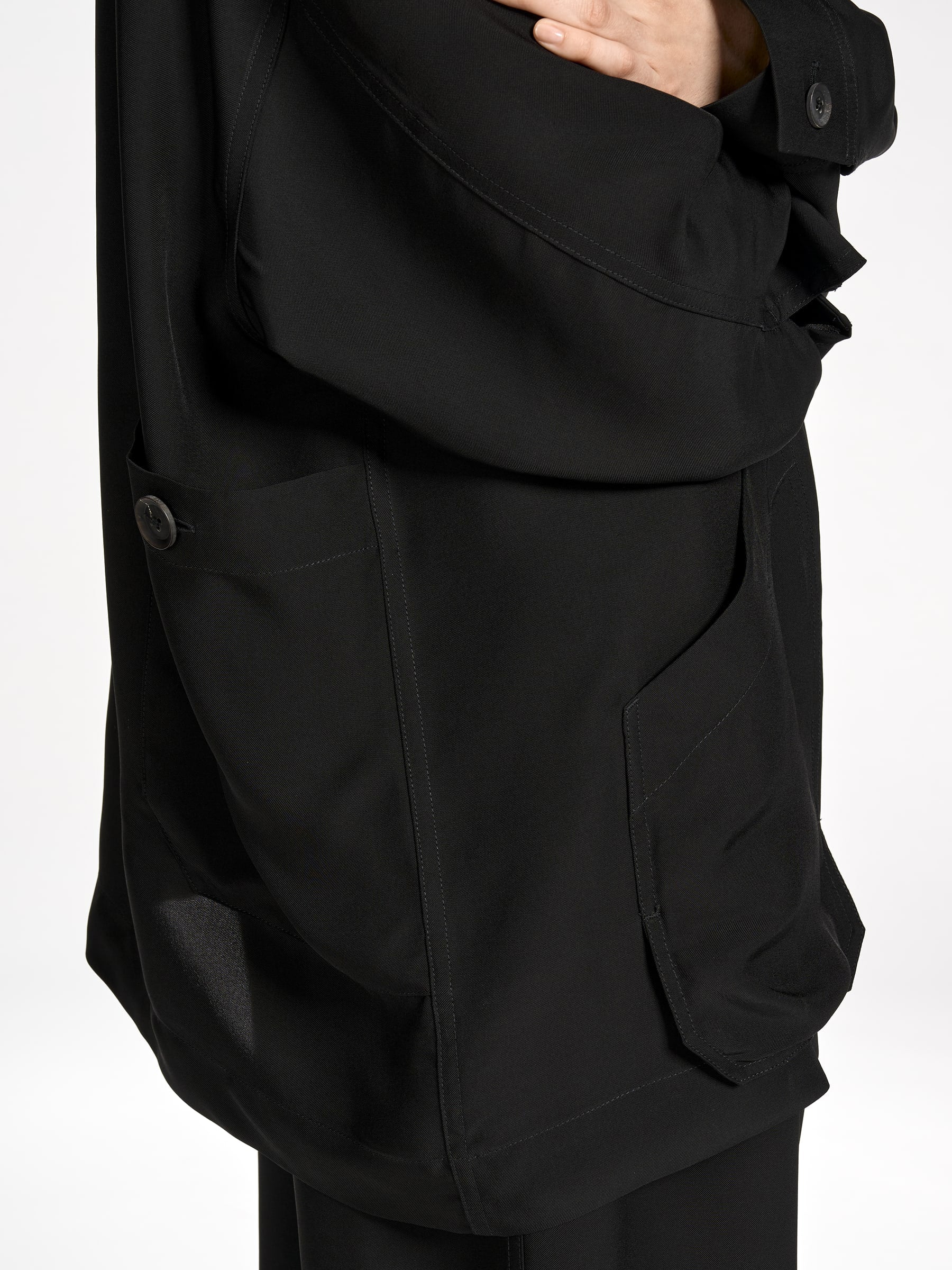 Close-up side view of the Y-3 Chore Jacket Shirt in Black on a model, highlighting the fabric texture and relaxed silhouette.