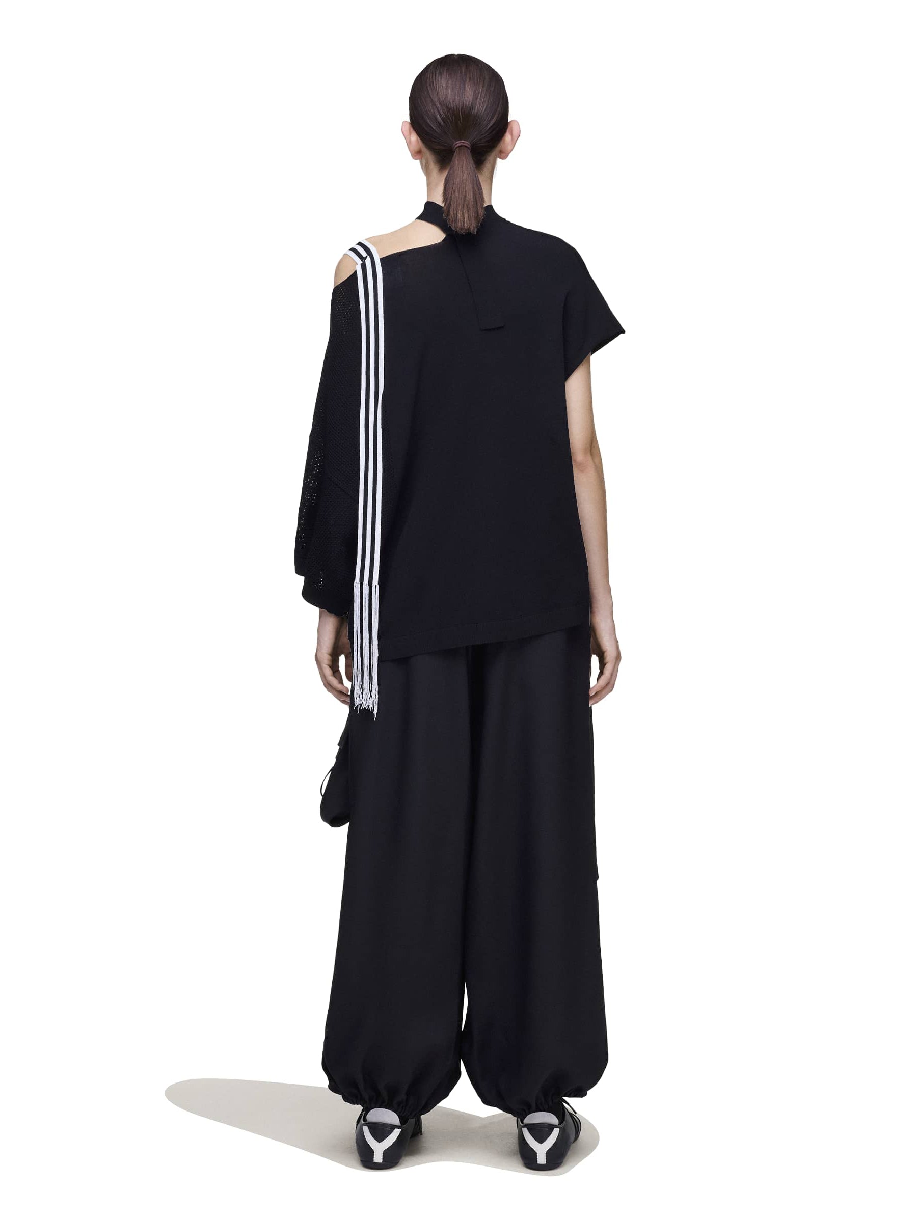 Back view of a female model wearing the Y-3 Knit Top in Black, highlighting the clean lines and contemporary silhouette.