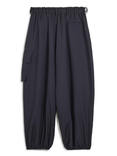 Back packshot of the Y-3 Sport Uniform Wide Cargo Trousers in Black, highlighting the wide-leg fit, rear flap pockets, and satin heat-transfer Y-3 logo.