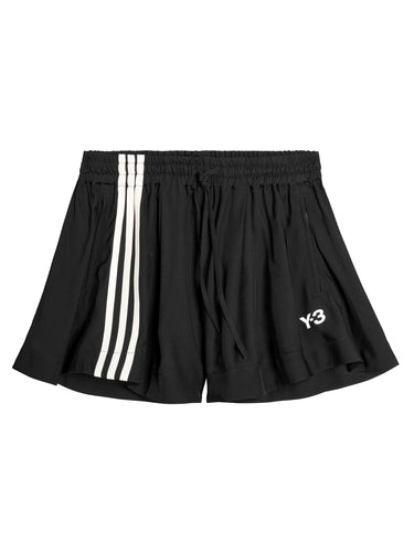 Front packshot of the Y-3 Women’s Tennis Shorts in Black, showing the sleek plain weave fabric, minimalist design, and straight hem.