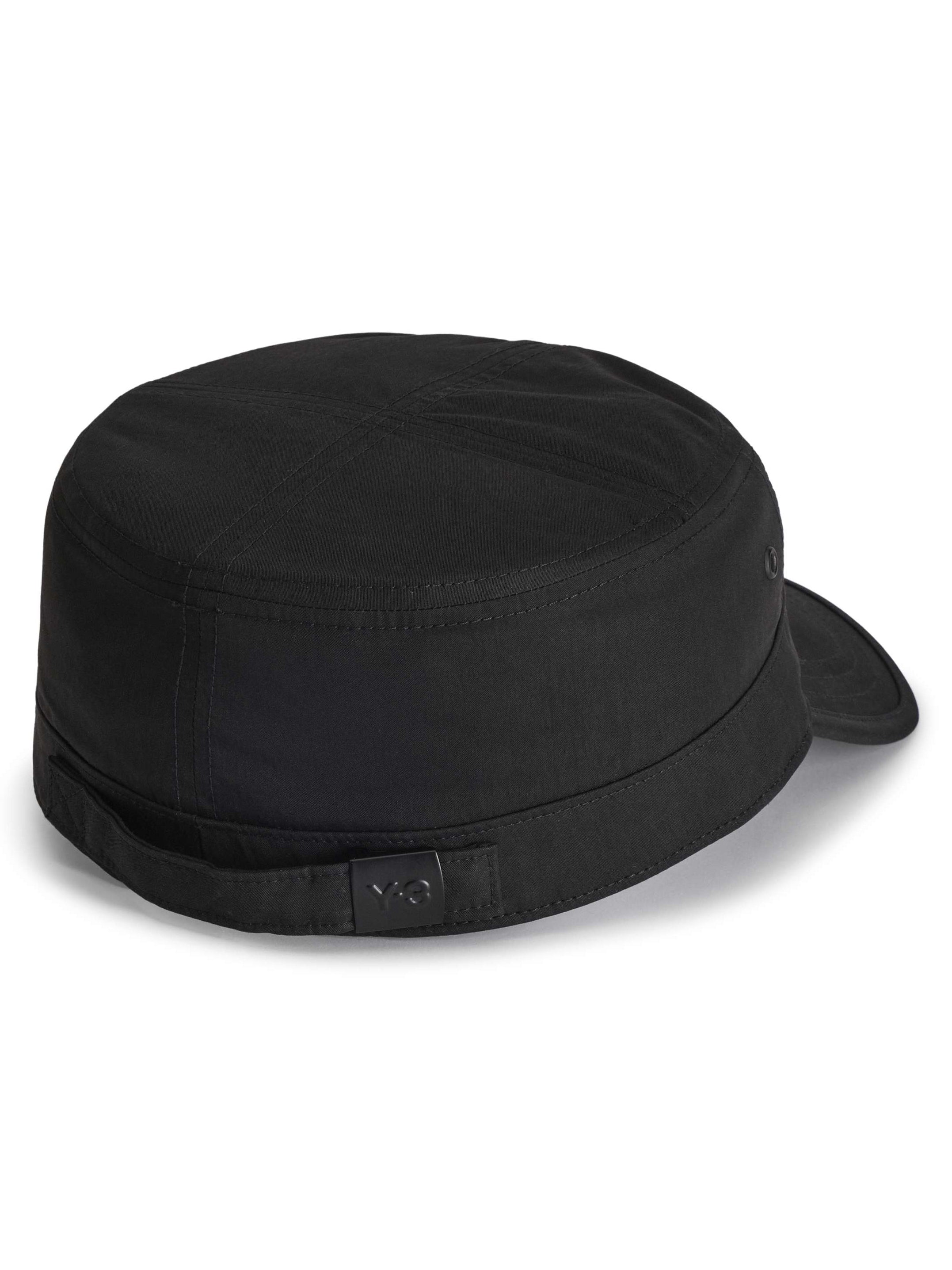Side-back packshot of the Y-3 Workwear Cap in Black, highlighting the structured shape, side ventilation eyelets, and inner sweatband.”