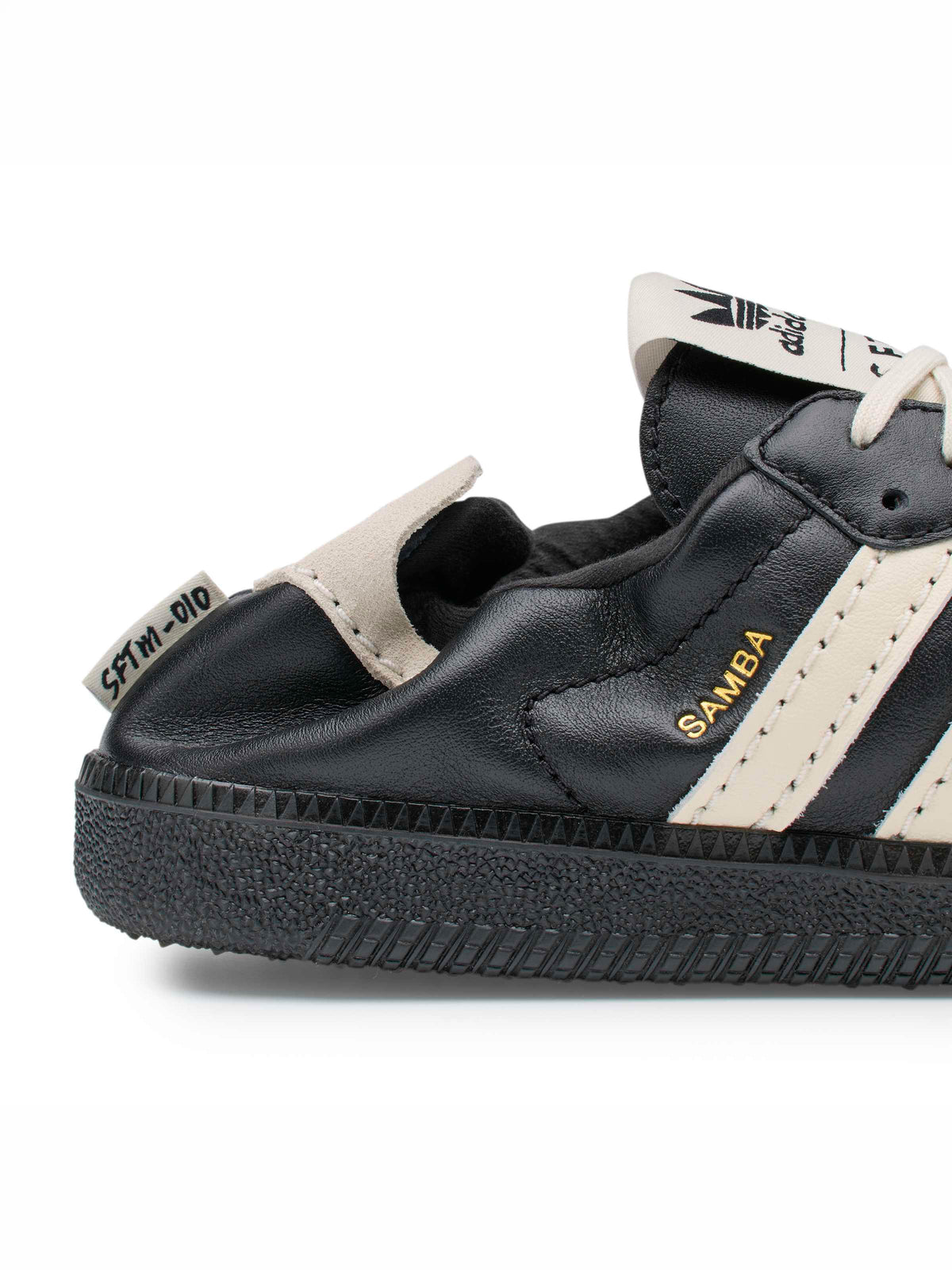 adidas x Song for the Mute ADI008 Samba OG SFTM sneaker, close-up side view with gold-tone branding.