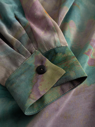 Alternate detail close-up of the Anntian Big Dress focusing on the long sleeve finish and flowing silk fabric with abstract multicolour print.