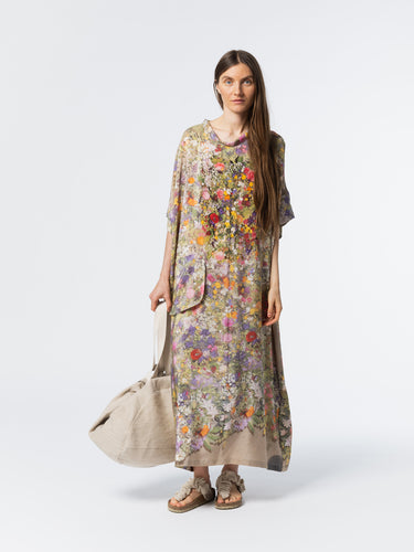 Front view of model wearing the Anntian Silk Dress in Print D, a multicolour floral print silk dress with a draped neckline, short sleeves, and front pocket in a relaxed fit