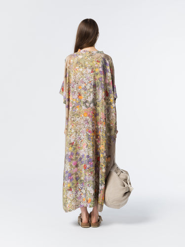 Back view of model wearing the Anntian Silk Dress in Print D, a relaxed-fit multicolour floral print silk dress with short sleeves