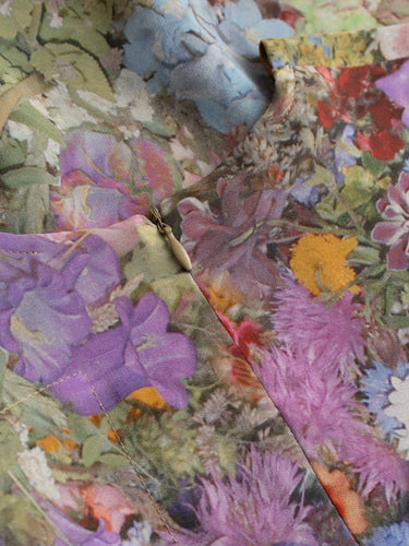 Simple Dress in Print G by Anntian, closeup of organic silk fabric showing richly detailed floral print with cornflowers, poppies, roses and wildflowers in blues, purples, oranges and pinks, Spring/Summer 2026