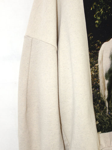 Close-up of the Anntian Unisex Sweater in Horse, showing the white horse print detail on an off-white knit fabric