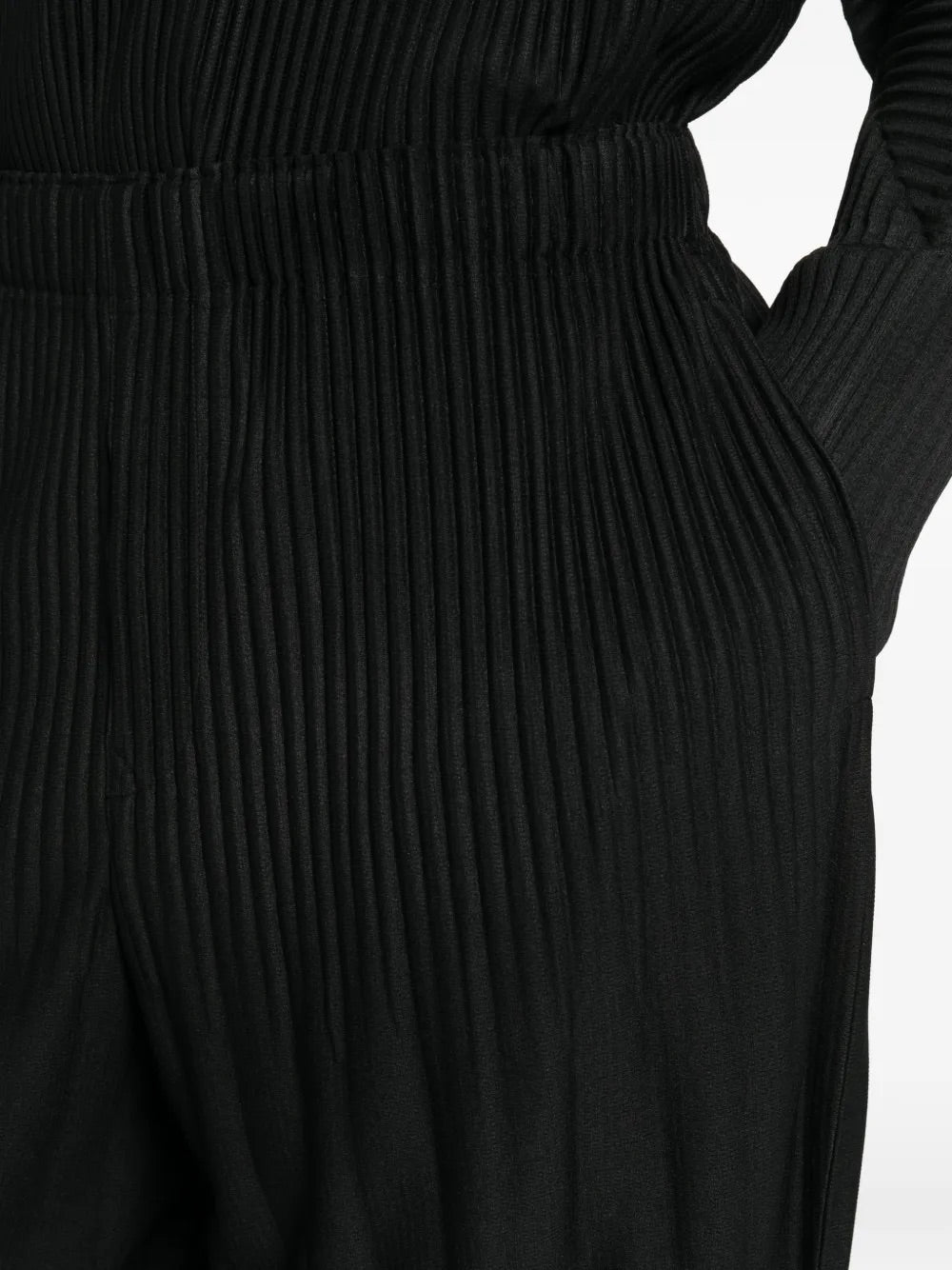 Close-up of Homme Plissé Issey Miyake black pleated texture