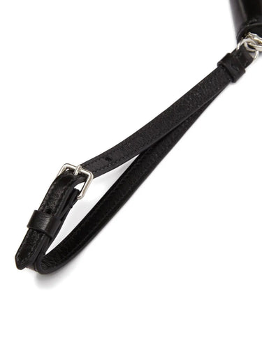Detailed packshot of the wrist strap on the Maison Margiela Big Halfmoon Pouch in Black, showing the smooth leather finish and secure attachment for carrying.