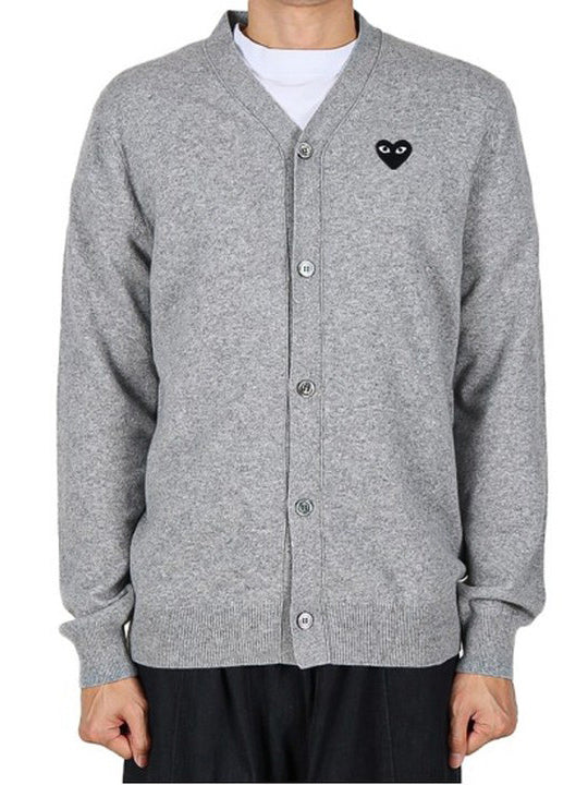 COMME des GARÇONS PLAY Unisex V-Neck Knit Cardigan Black Heart in Light Grey worn on model, front view.