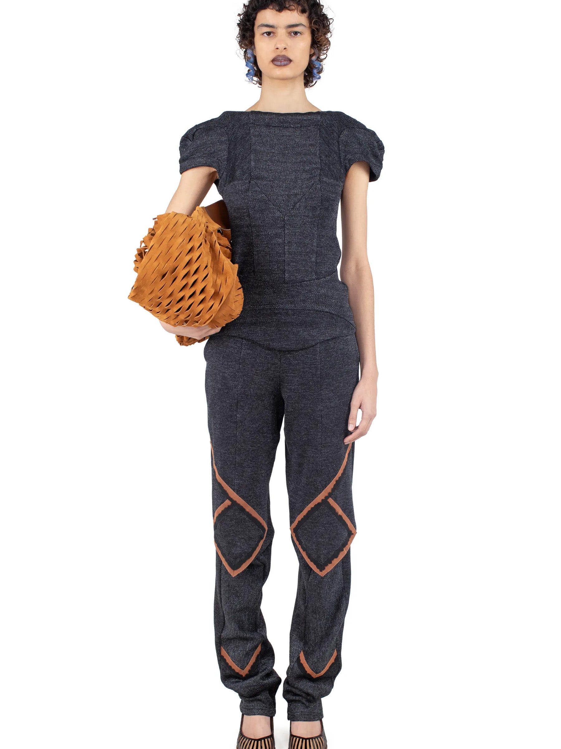 Model wearing the Kiko Kostadinov Compass Jersey Top in Abyss Black from the front.