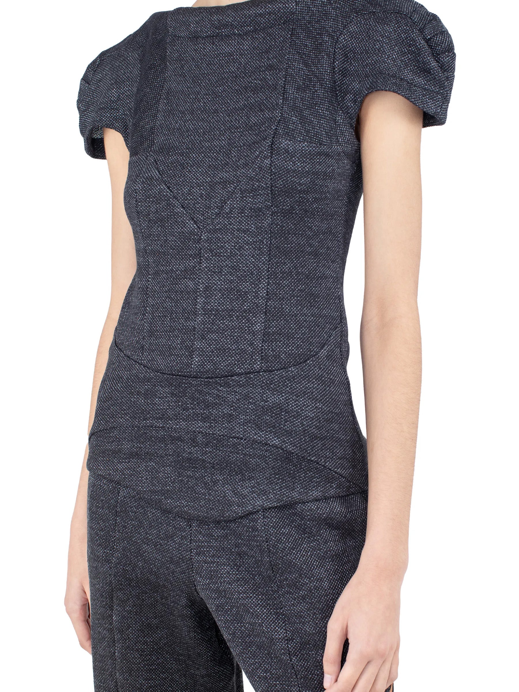 Close-up side detail of the Kiko Kostadinov Compass Jersey Top showing the fitted construction.