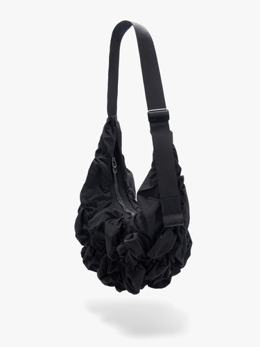 Côte&Ciel Hyco S Otra Gathered crossbody bag in black, diagonal view highlighting ergonomic shape and textured ruched nylon material.