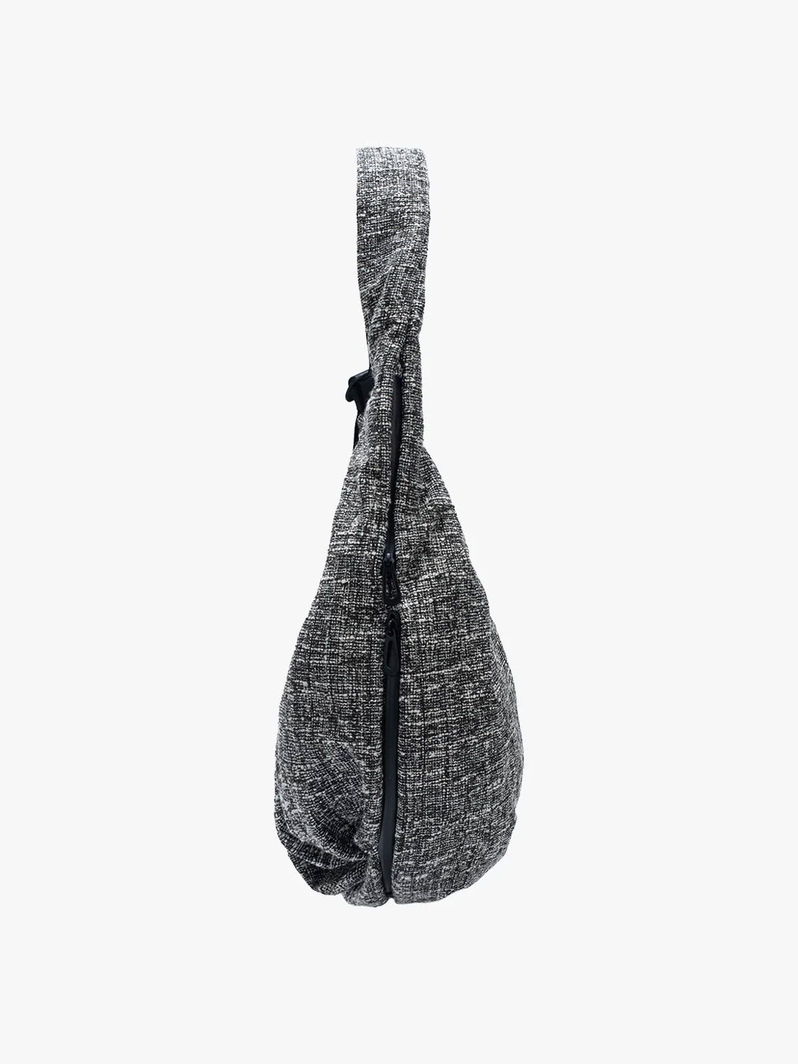 Side view of Côte & Ciel Hyco S Tweed in Black & Cream showing the curved construction and zippered side compartment