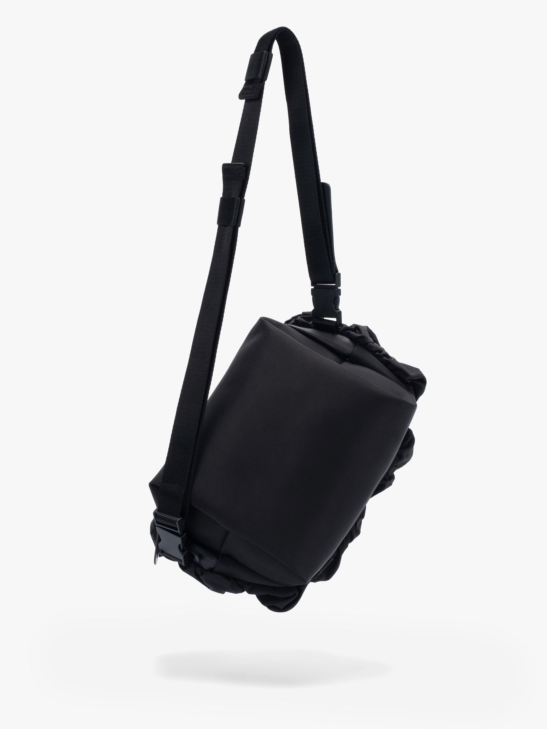 Côte&Ciel Neva Gathered black crossbody bag, back view showing ergonomic sculptural shape and gathered nylon texture.