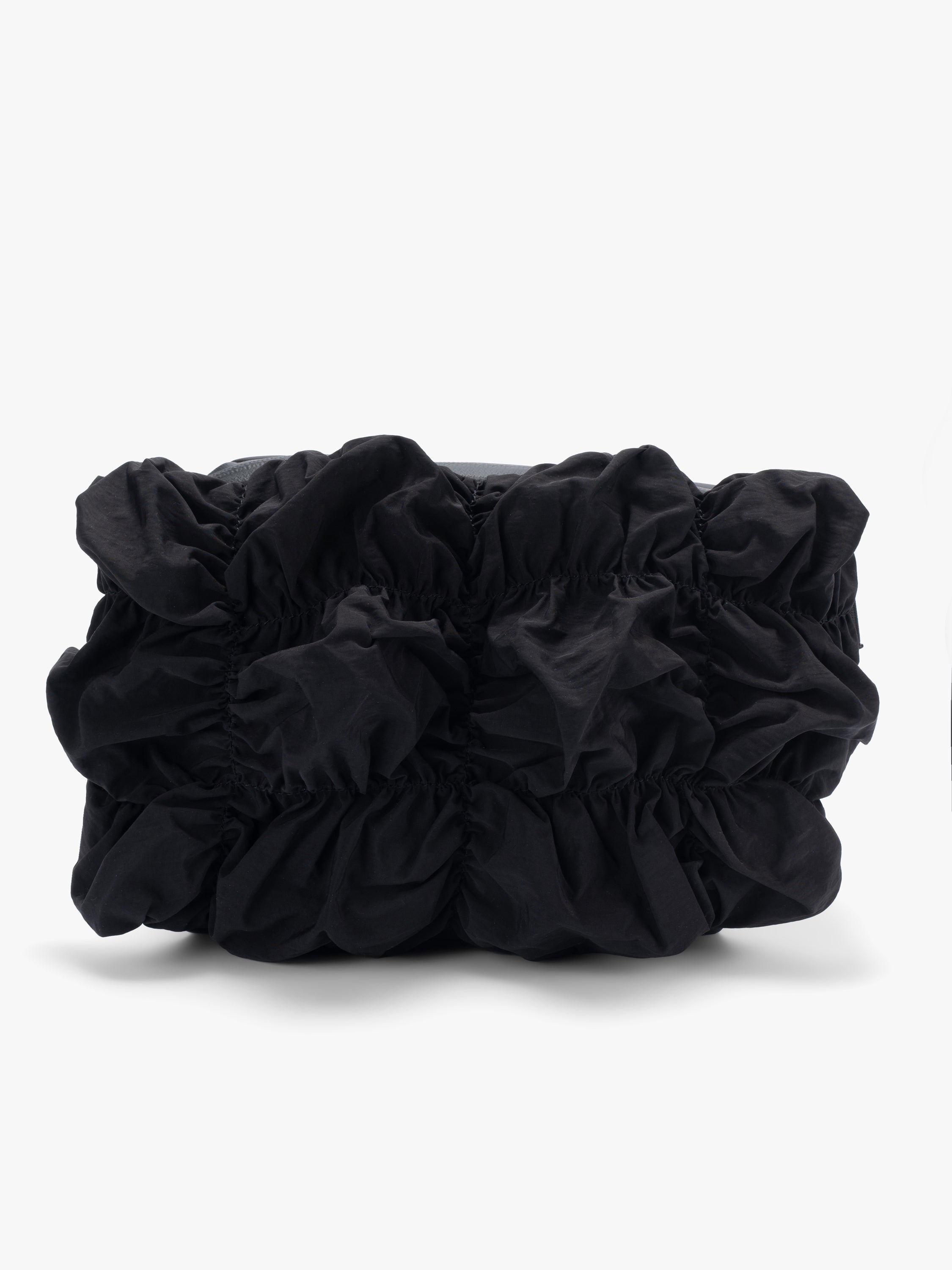 Côte&Ciel Neva Gathered crossbody bag in black, front angled view highlighting sculptural gathered nylon and compact storage compartments.