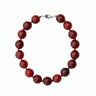 Round and red carnelian necklace with silver clasp from De Silang on a white background
