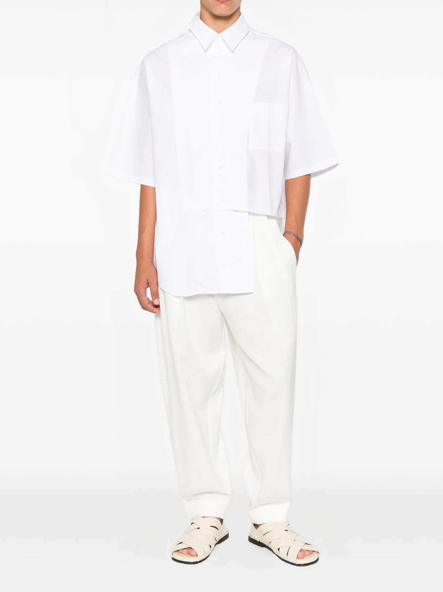 House Of The Very Islands Harley Asymmetric Shirt in White - full length front view on model showing relaxed fit and asymmetric seam detail