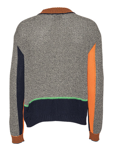 Back full-body packshot of the Abundance Cardigan highlighting the block-color design in black, white, and navy with subtle orange detailing and a straight hem