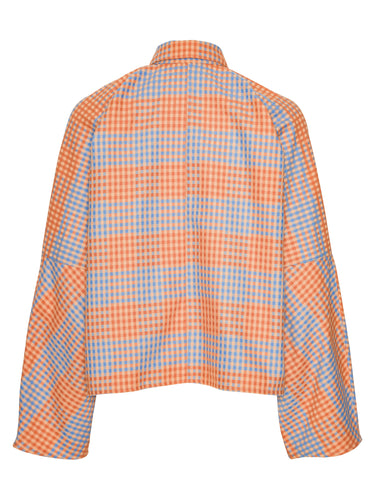 Orange and blue checkered shirt from Henrik Vibskov on a white background