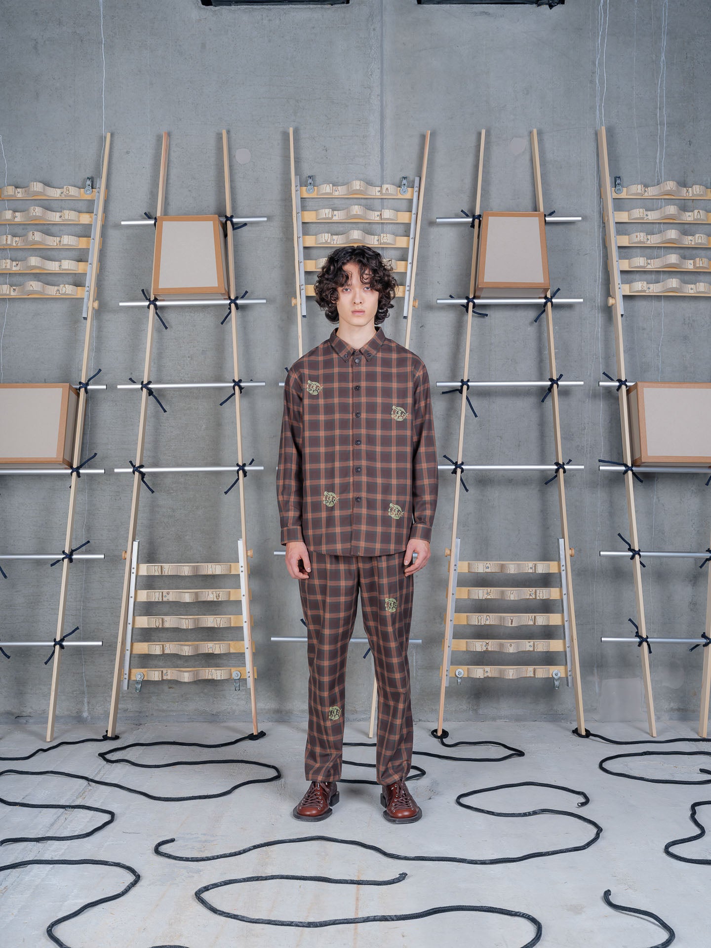 Henrik Vibskov Block Shirt Brown Cotton Checks, model front view, styled as a co-ord with matching checked trousers