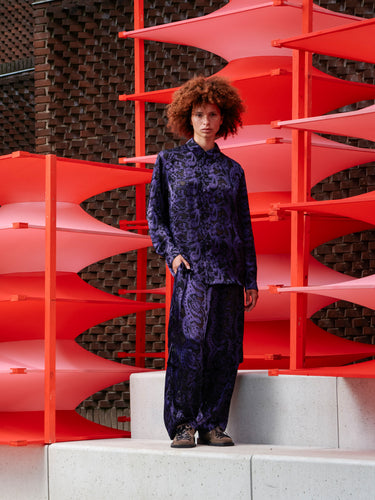 Front view of a model wearing the Block Shirt in dark purple Victorian Burnout fabric with classic collar and relaxed fit.