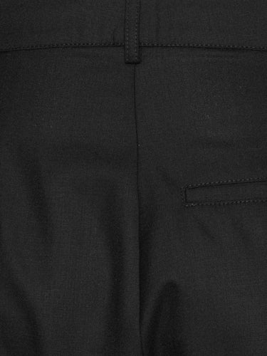 Back close-up packshot of the Claus Pants in Tropical Black from Henrik Vibskov Spring/Summer 2026 Studio Collection, focusing on the waistband, belt loops, and back detailing.