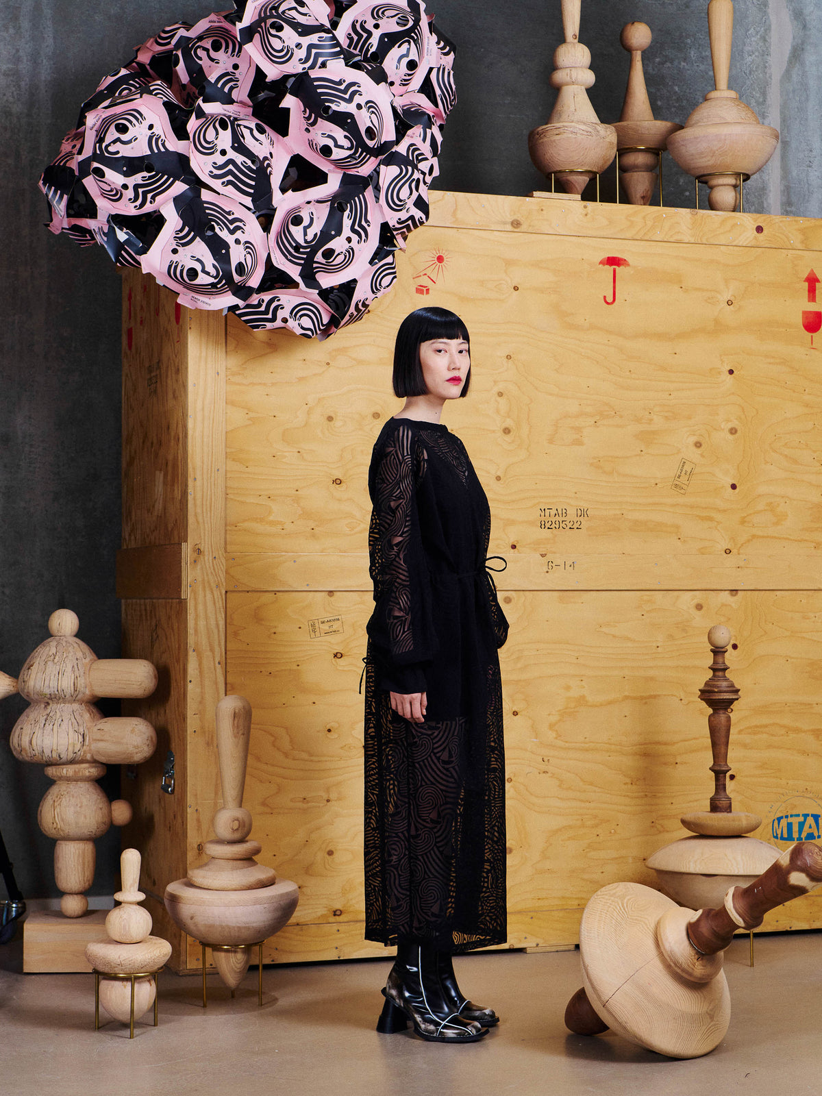 Side view of model wearing the Henrik Vibskov Delivery Blouse in Dark Stormy Sea, showing the relaxed silhouette, long sleeves and gathered cuffs.