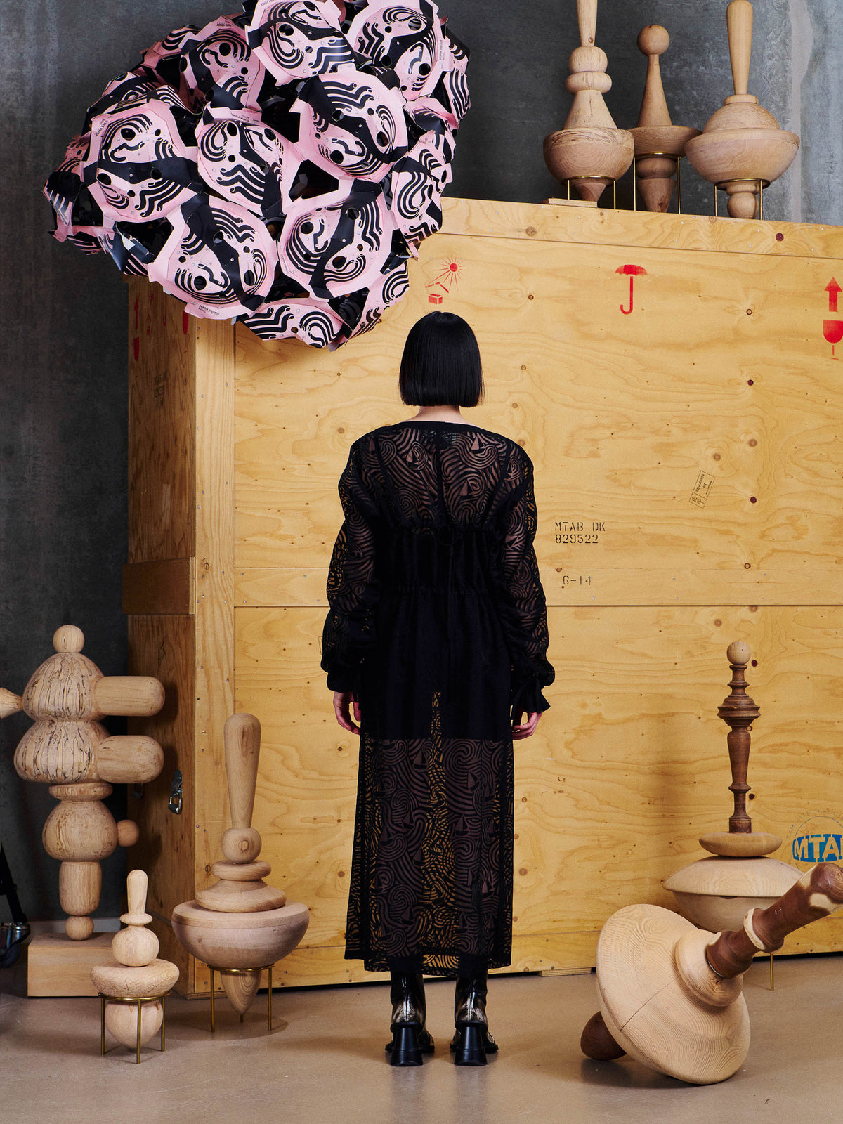 Back view of model wearing the Henrik Vibskov Delivery Blouse in Dark Stormy Sea, showing the semi-sheer wave pattern and relaxed fit.